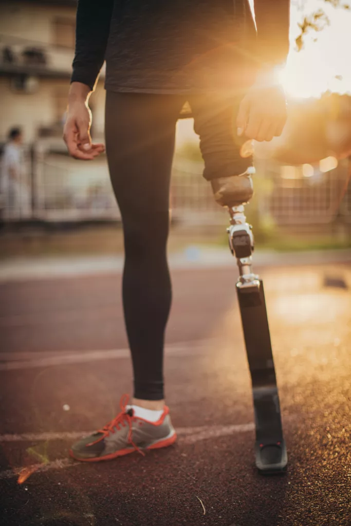 Disability guy standing on race track Disability guy standing on race track